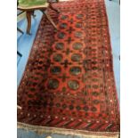 A hand woven Persian design rug having multiguard borders and geometric design, 205cm x 108cm