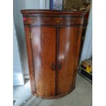 A George III marquetry and mahogany inlaid bow front corner cabinet Location: