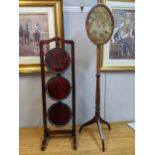 A Regency string inlaid mahogany pole screen and a reproduction mahogany finished cake stand