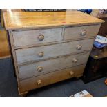 A Victorian pine chest of two short and three long drawers having bun shaped handles and turned