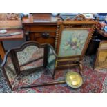 A Victorian walnut firescreen with a rising panel and barley twist supports, and an early 20th