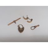 Mixed gold items to include a 9ct gold heart shaped padlock clasp, 9ct gold bulldog clasp, a 9ct