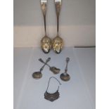 Mixed silver to include a pair of Georgian berry spoons, a pair of golf spoons and a floral