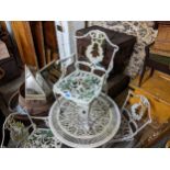 A late 20th century white painted cast metal garden table and four chairs Location: