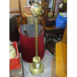 A brass Victorian oil lamp later converted to a standard lamp, 134cm h
