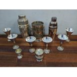 Silver plate to include two cocktail shakers, goblets, a wine bottle coaster, a silver egg cup and
