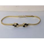 A 9ct gold sapphire and white stone set bracelet, 5.2g