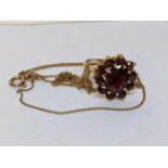 A 9ct gold garnet set ring, together with a 9ct gold necklace, 5.1g