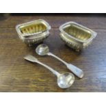 A pair of Victorian silver salts with fluted top rim and lower half of body, on ball feet, Chester