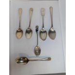 A group of six silver spoons to include a pair of George III 1815 London hallmarked examples and