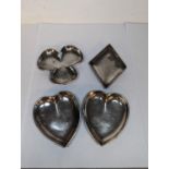 A set of four silver ashtrays, each fashioned as a card suite, 103.4g Location: