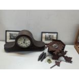 A mixed lot to include a Napoleon hat style mantel clock, cuckoo clock and a pair of framed and