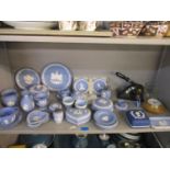 A selection of Wedgwood blue jasperware pin dishes, boxes, plates and other items including a