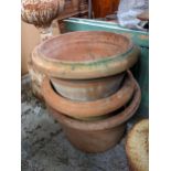 Three terracotta garden plant pots, each approximately 50cm dia A/F Location: