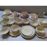 A selection of Belleek to include Neptune cups and saucers