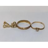 Two 9ct gold rings to include one inset with a paste stone, together with a pair of 9ct gold