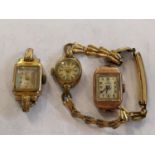 A ladies 9ct gold cased watch and two similar gold plated examples Location: