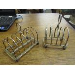 Two silver toast racks, a George V six-compartment toast rack on ball feet, Sheffield 1929 marks for