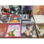 A large collection of easy listening, theatrical shows and swing LPs, all housed in a plastic