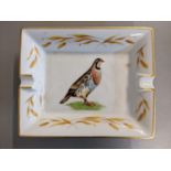 A Hermes ashtray painted with a hawk to the centre and gilt highlights Location: