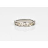 A platinum and diamond half eternity ring, with ten channel set round brilliant cut diamonds,