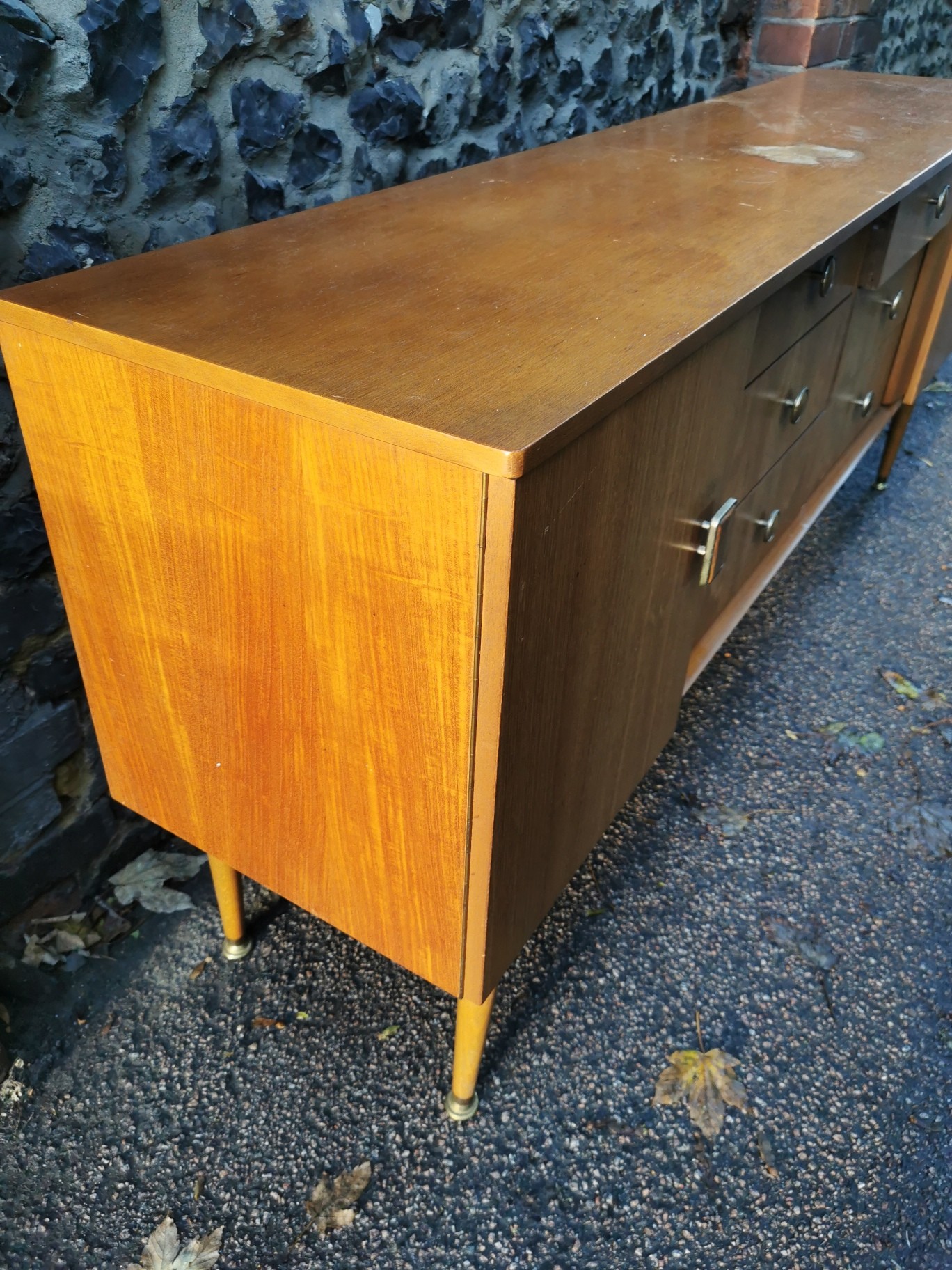A 1970s design light teak sideboard, with six drawers to the centre flanked by a cupboard door - Image 3 of 3