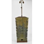 A Chinese heavy bronze lamp in the archaic design, of tapered rectangular form, on a wooden base,