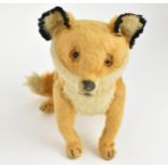 A vintage Steiff style fox soft toy, approx 38cm long tail to nose Location: