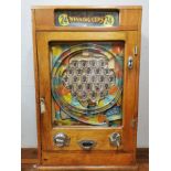 A mid century Oliver Whales Allwin '24 winning cups' mechanical arcade machine, the penny slot