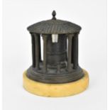 A 19th century Grand Tour patinated bronze inkwell in the shape of a classical rotunda, possibly the