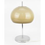 A mid century Guzzini style table lamp, circa 1960 - 1970, with a mushroom shade, on a chrome stem