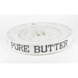 A large 'PURE BUTTER' ceramic shop display plate, the underside marked 'H. Marsh ...Manchester',