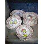 A late 19th century Bohemian porcelain dessert service decorated with flower sprays to the centre,