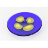 A Czech studio glass dish by Ales Valner, of circular form in cobalt blue with four yellow blobs