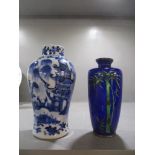 A Chinese blue and white inverted baluster vase decorated in a Willow Tree variant, with two figures