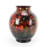 A large Walter Moorcroft flambe glazed pottery vase, in the 'anemone' pattern, of globular form with