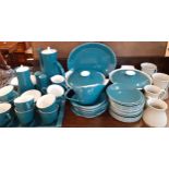 A quantity of vintage Poole dinner, tea and coffee items in a teal and white colour together with
