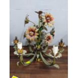 An Italian style painted metal six branch chandelier fashioned as flowers and foliage Location: