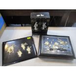 A Japanese bone inlaid black lacquered papermache photograph album and board and a table top cabinet