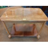 A late 20th century lacquered walnut trolley Location: BWR