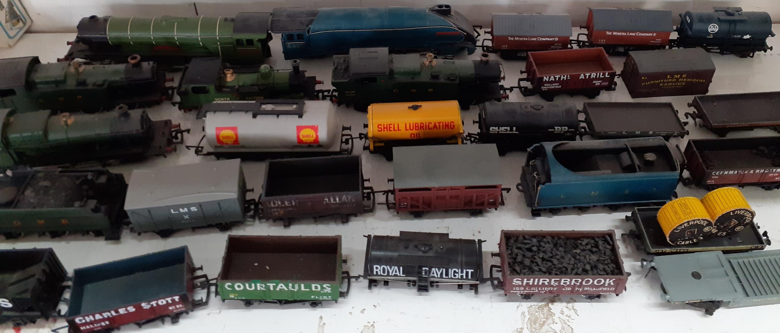 A quantity of model railway engines, and rolling stock to include Empire of India, North Eastern,