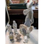 A large Lladro figure of a lady with a dog together with other porcelain figures Location: