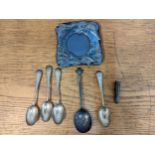 Four silver teaspoons, a spoon with a cherub terminal, a cheroot holder A/F 130g, and a late 20th