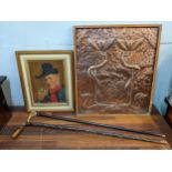 An Arts & Crafts copper plaque decorated with flowers, two walking sticks, and a portrait oil on