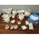 Mainly cream glazed ceramics to include a shorter jug inscribed Freya with incised decoration, in