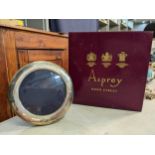 A silver fronted circular photograph frame in an Asprey box Location: