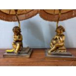 A pair of 20th century gilt metal lamps each of a child, on a plinth stamped P H Mourey Location:
