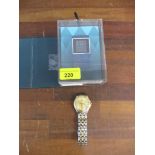 A Raymond Wail quartz gents wrist watch and a boxed Fitbit surge watch Location: