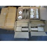 Four boxes of Trade Winds table ware to include mugs, plates, etc Location: