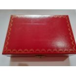 A small red Cartier jewellery box